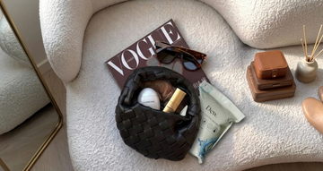 Flat lay of accessories including a handbag and sunglasses, comparing moisture absorber solutions for protecting items from humidity